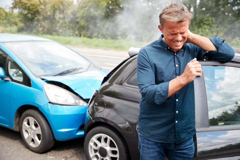 a man with injuries after having a car accident